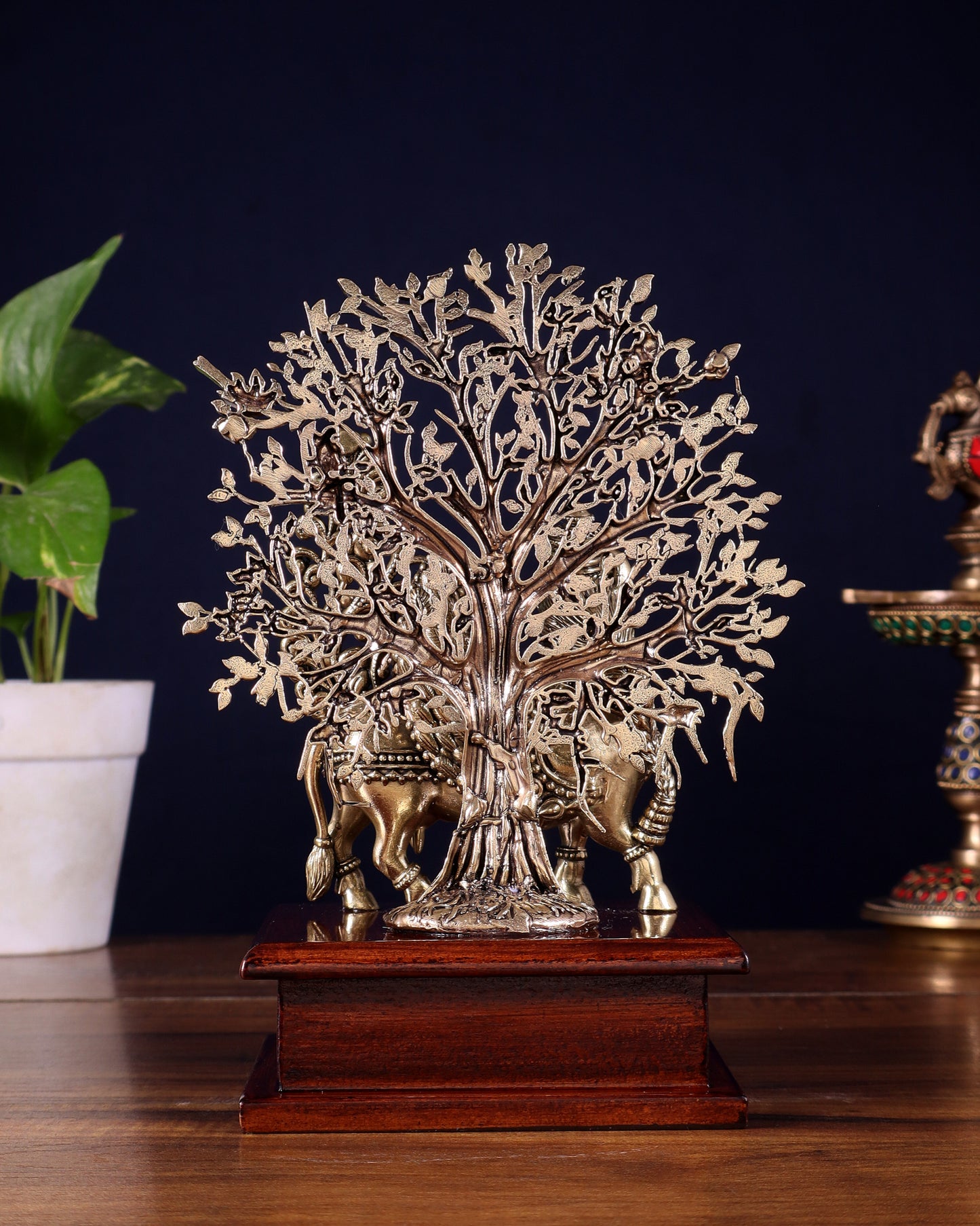 Brass Superfine Kamdhenu Cow with Goddess Face under Kalpavriksha tree on Wooden Base – 8 Inch