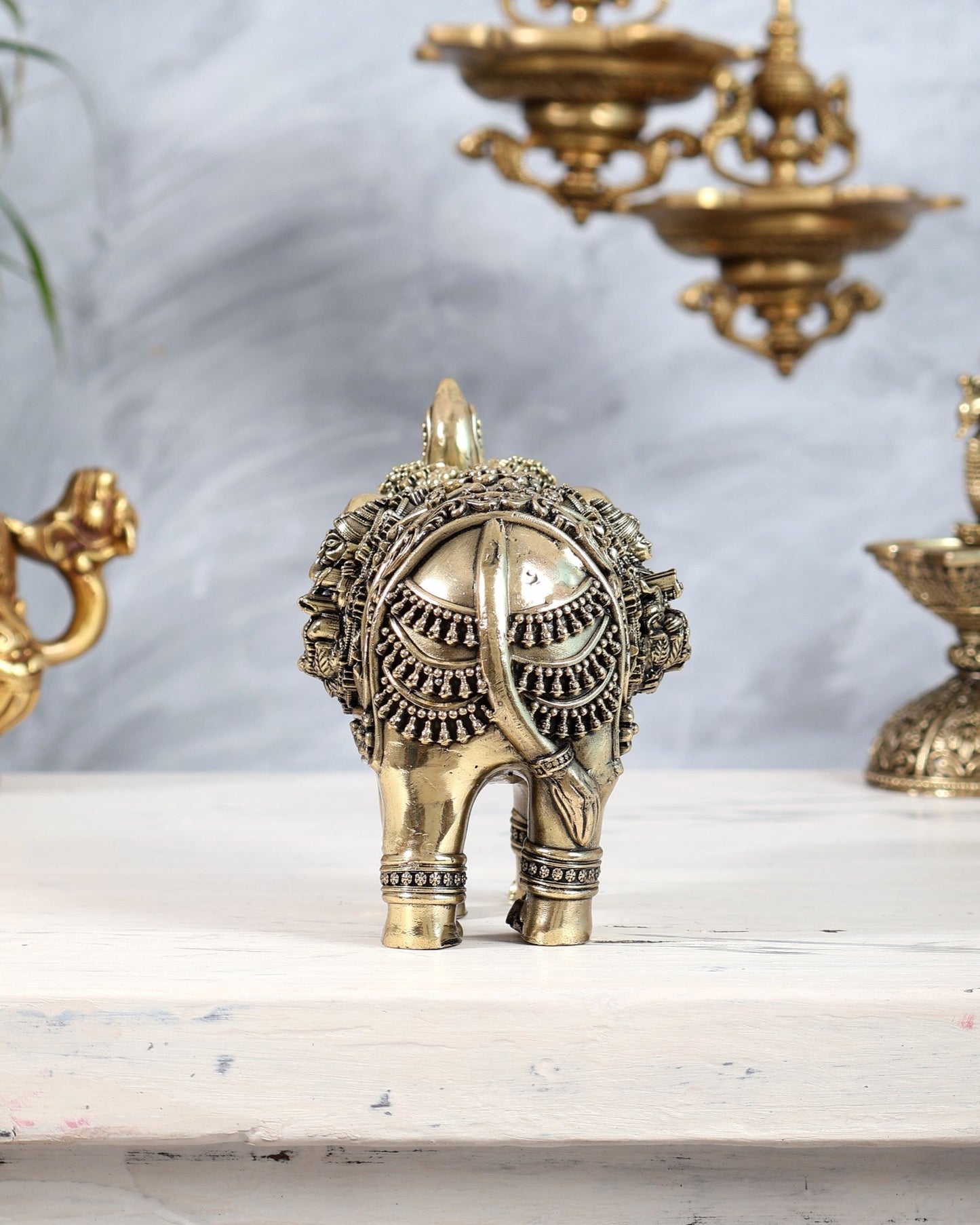 Brass Elephant Showpiece Trunk Up with Ganesha Lakshmi Carvings | Auspicious Décor Figurine 6" wide - Budhshiv.com