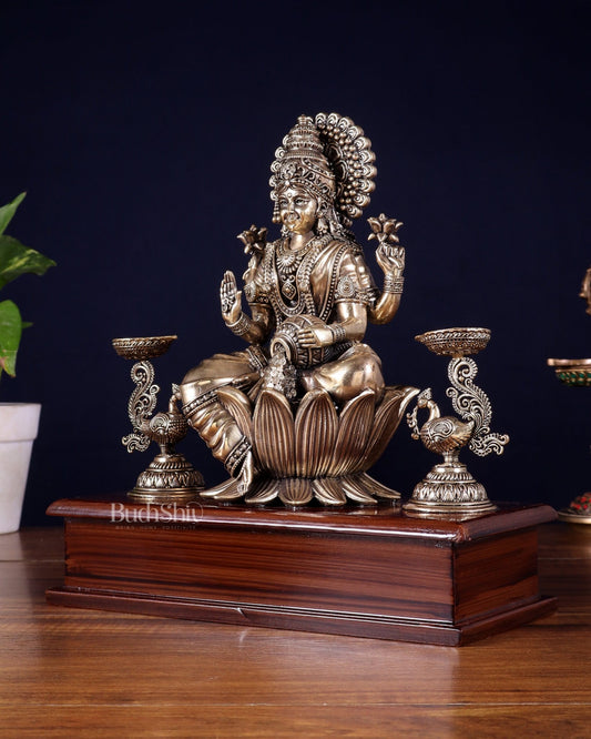 Brass Superfine Goddess Lakshmi Idol with Twin Peacock Lamps on Wooden Base – 9.5 Inch - Budhshiv.com