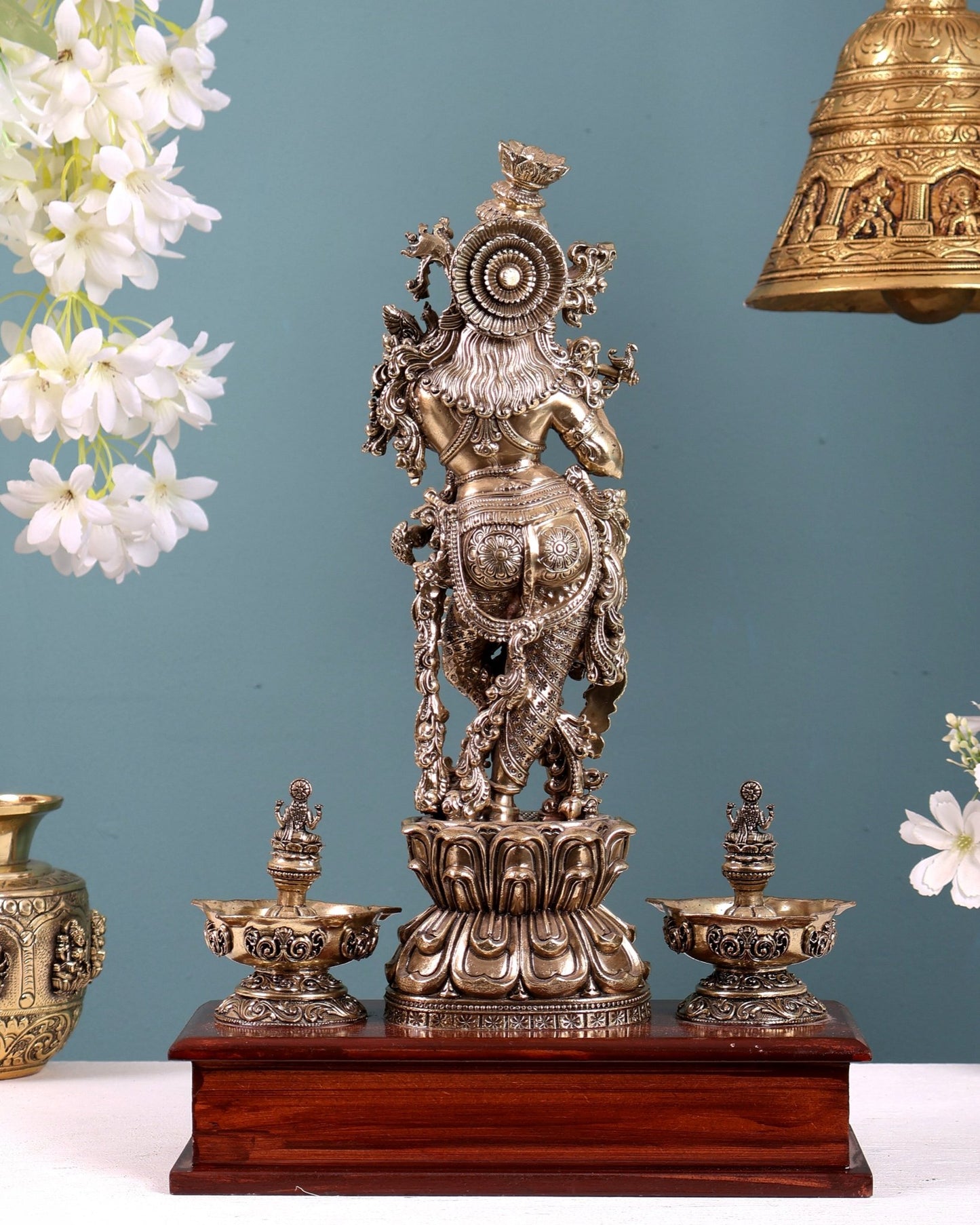 Brass Superfine Lord Krishna Idol with Twin Lakshmi Diyas on Wooden Base - Budhshiv.com