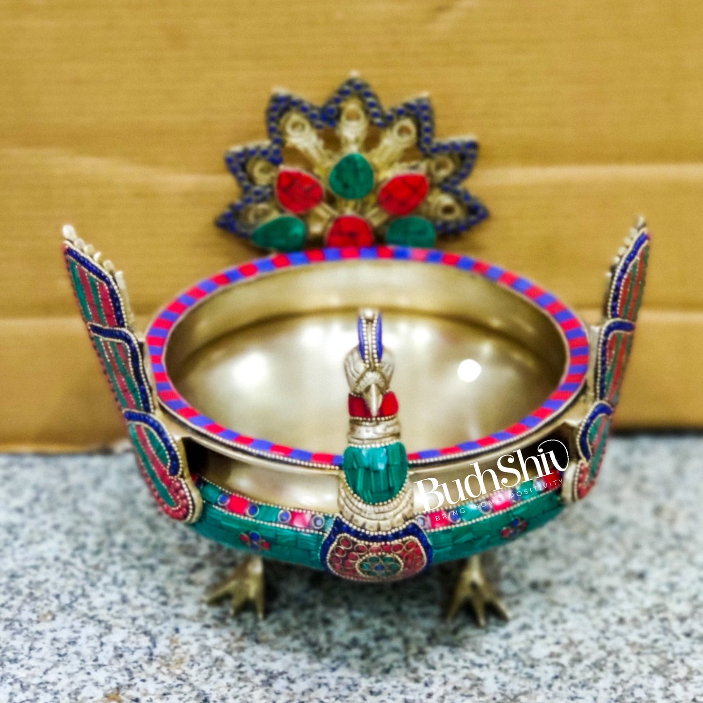 Brass peacock shaped urli with stonework - Budhshiv.com