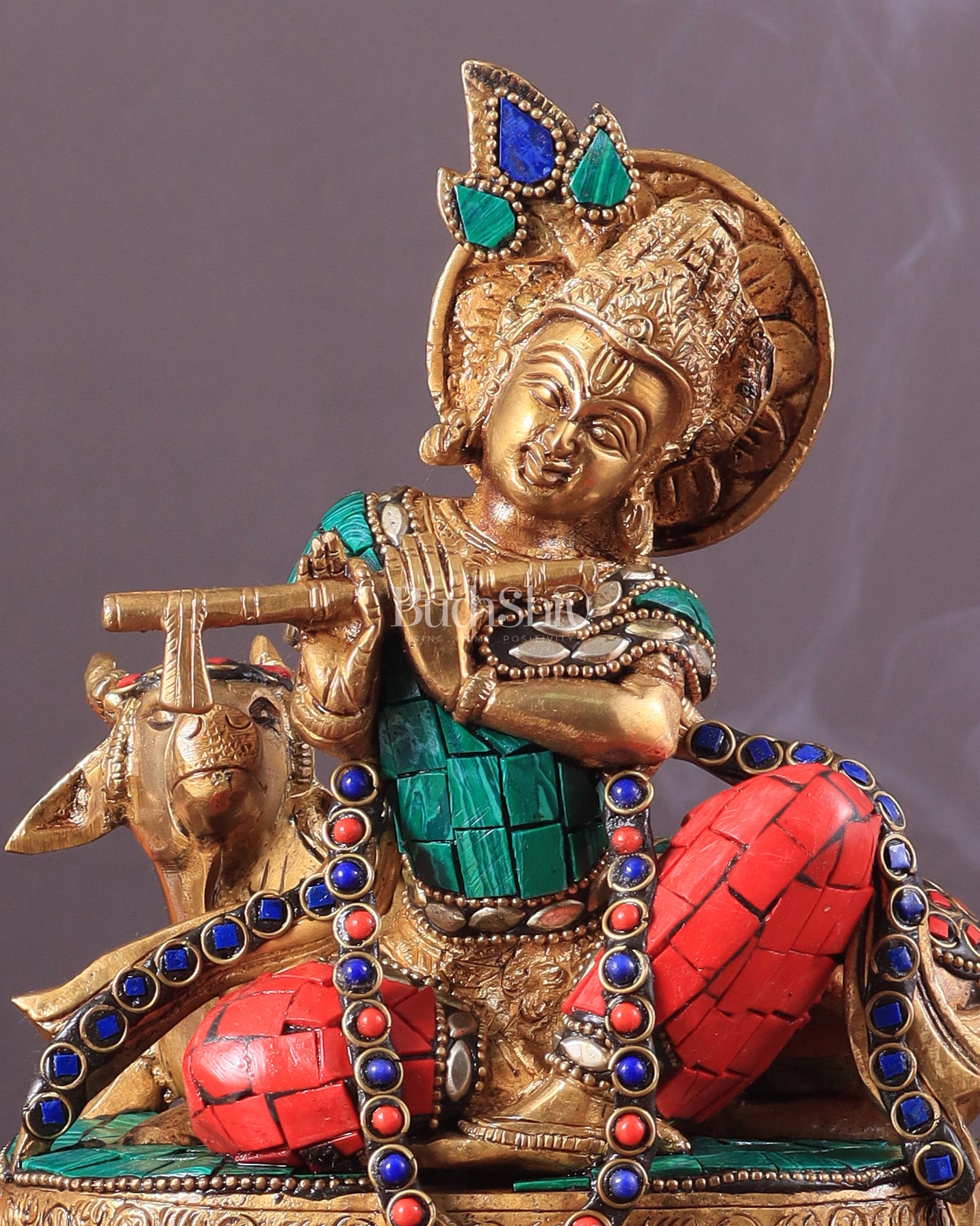 krishna seated with a cow on round base 7.5"