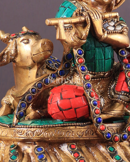 krishna seated with a cow on round base 7.5"