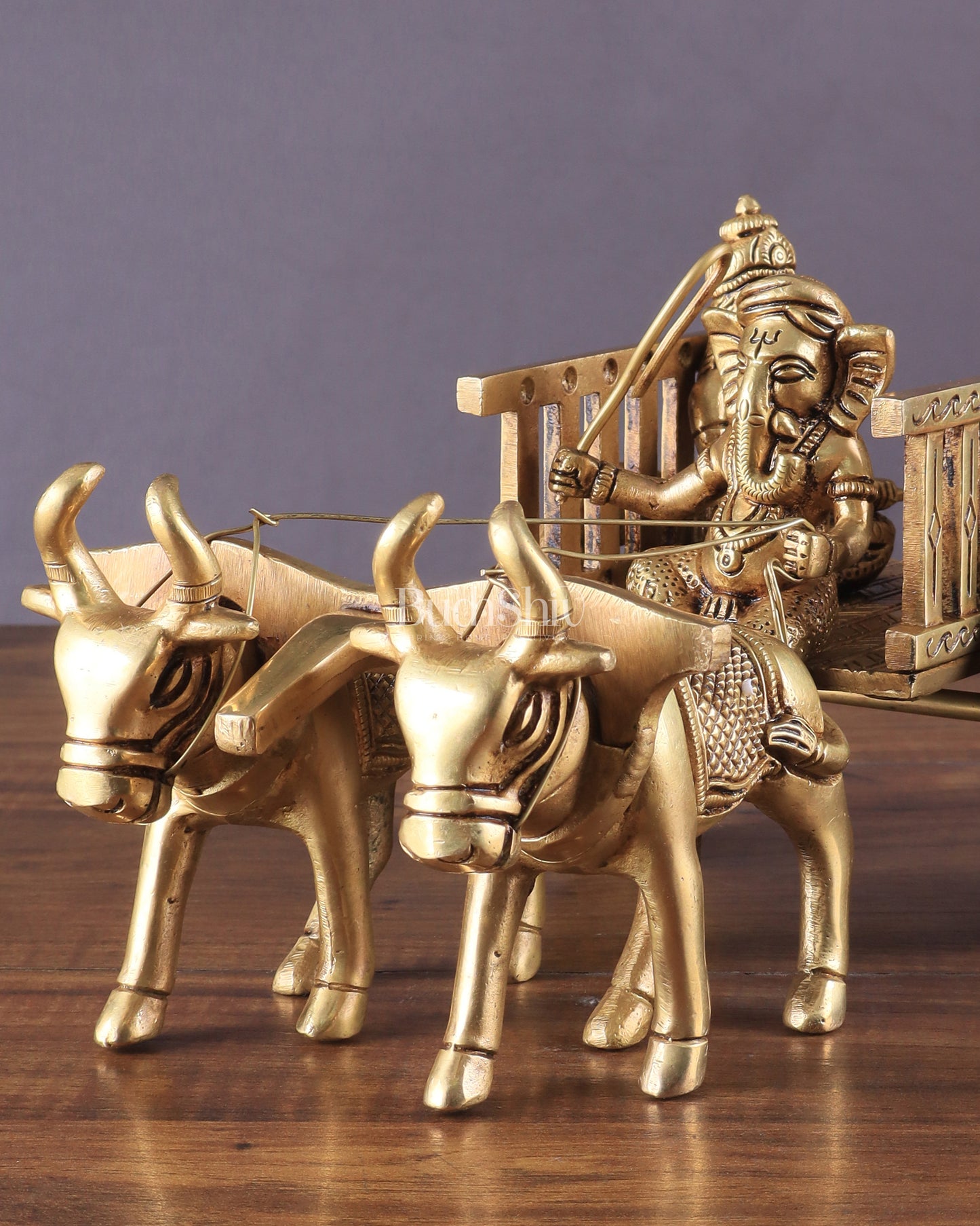 Brass Ganesha showpiece bullock cart with riddhi siddhi enhanced carvings