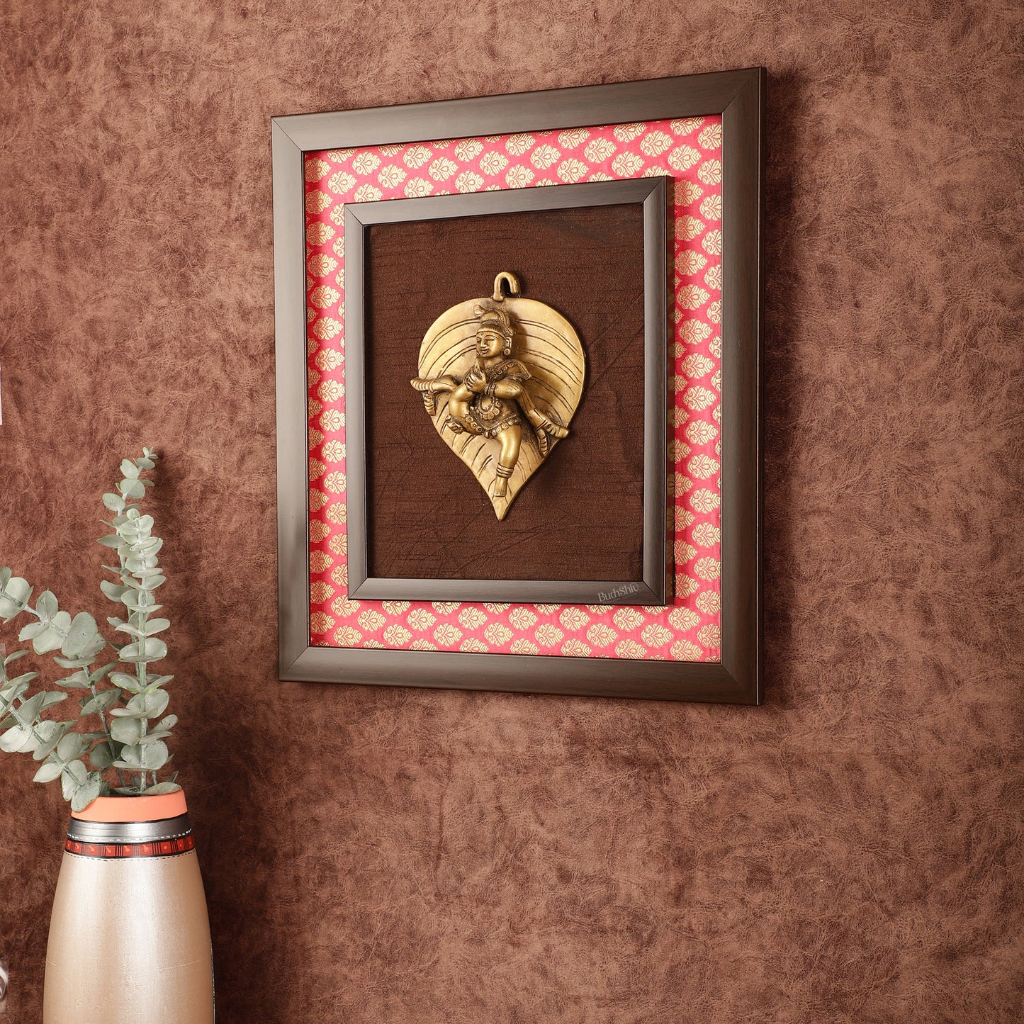 Brass Baby Krishna Baal Gopal Resting on a Leaf Hanging on Wooden Frame with Premium Fabric - 13" x 14"