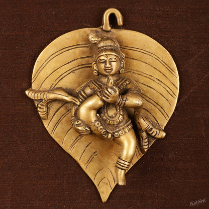 Brass Baby Krishna Baal Gopal Resting on a Leaf Hanging on Wooden Frame with Premium Fabric - 13" x 14"