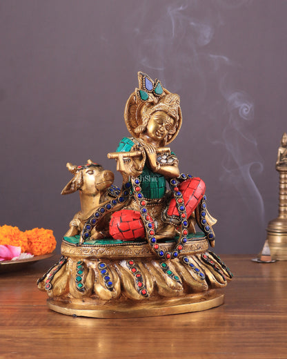 krishna seated with a cow on round base 7.5"