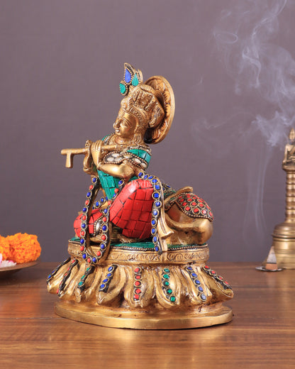 krishna seated with a cow on round base 7.5"