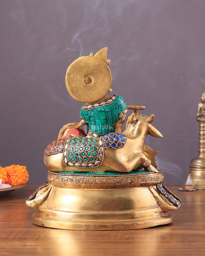 krishna seated with a cow on round base 7.5"