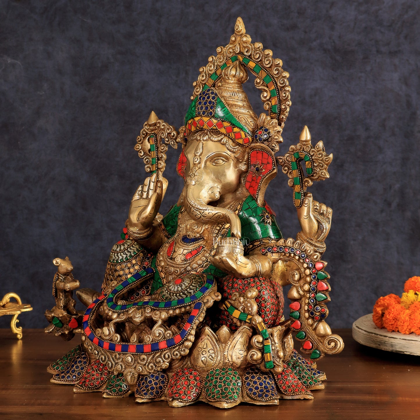 Brass Ganapati statue with sharp features - 16 inches