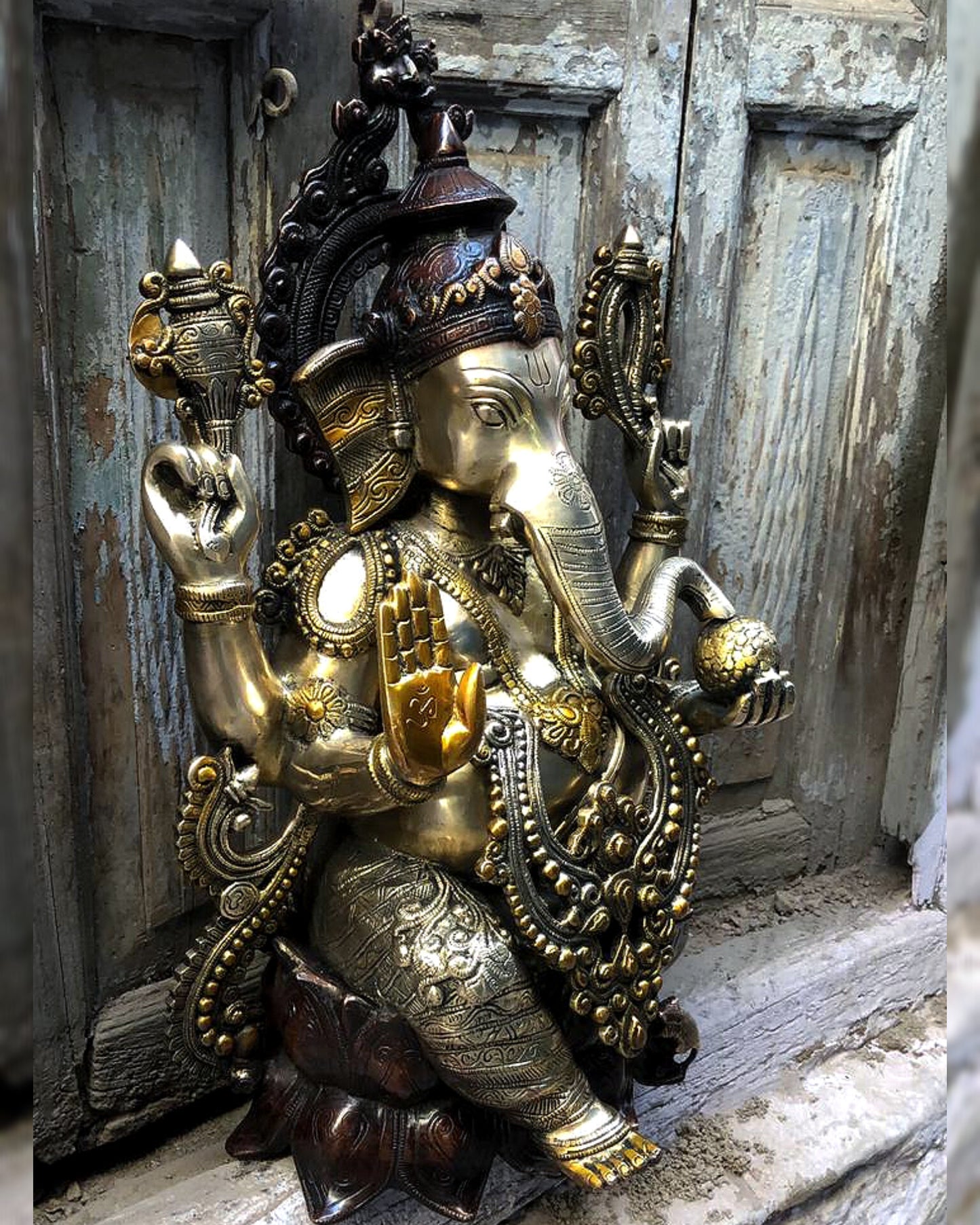 Ganesha Brass Idol 21 inches high seated on a lotus base