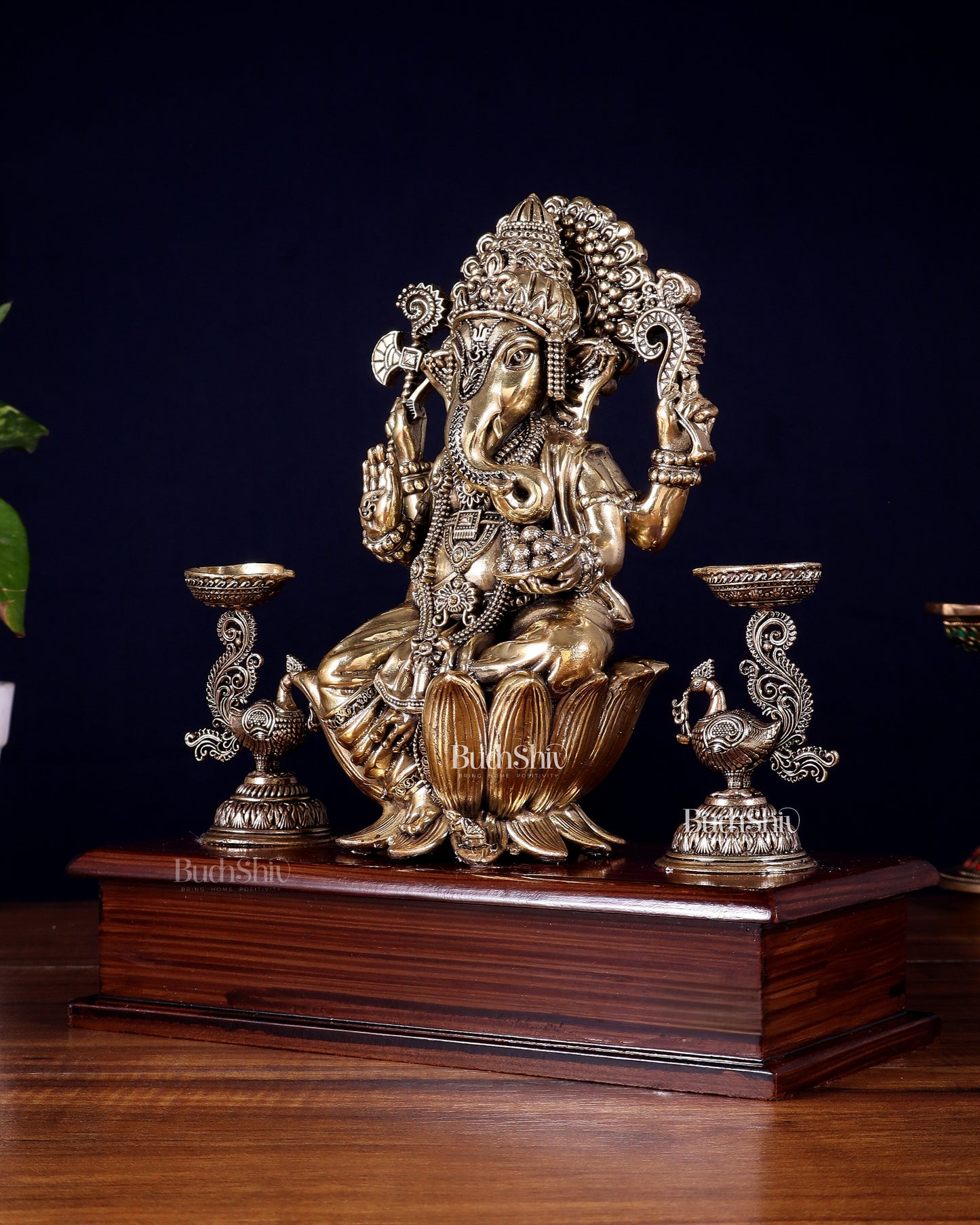 Brass Superfine Lord Ganesha Idol with Twin Peacock Lamps on Wooden Base – 9.5 Inch