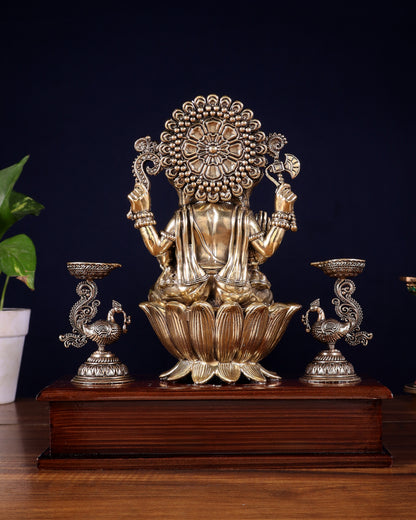 Brass Superfine Lord Ganesha Idol with Twin Peacock Lamps on Wooden Base – 9.5 Inch