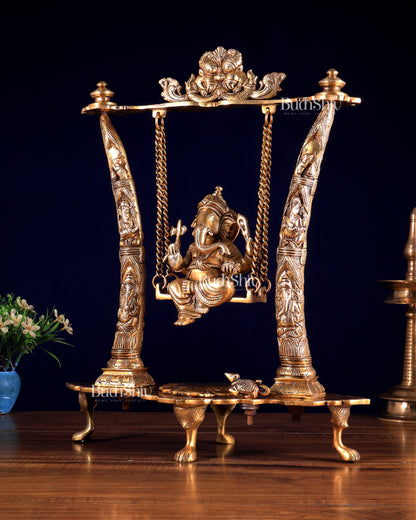 Brass Ganesha Idol on Swing with Pillars Decorated with Ganesha Figures 17 inch