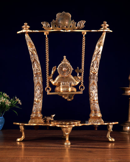 Brass Ganesha Idol on Swing with Pillars Decorated with Ganesha Figures 17 inch