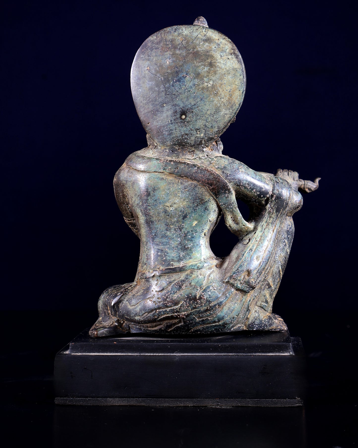 Balinese Bronze Krishna Playing the Flute – Seated on Wooden Base 6.7 inch