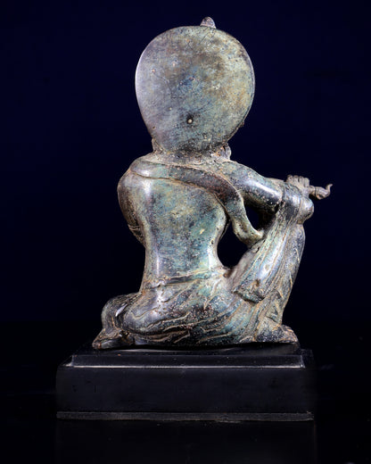 Balinese Bronze Krishna Playing the Flute – Seated on Wooden Base 6.7 inch