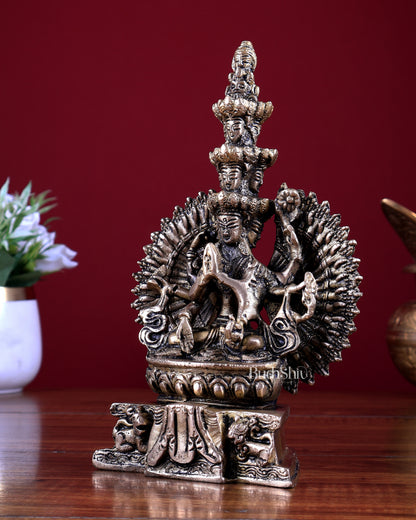 Brass Seated Avalokiteshvara with Many Heads and Hands 9 inch
