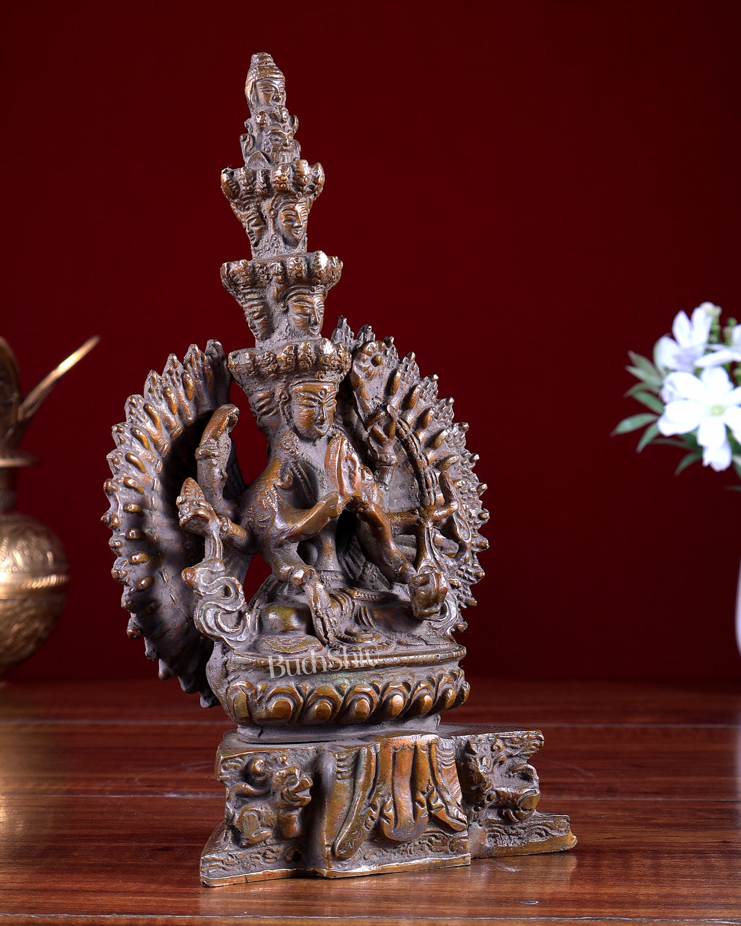 Brass Seated Avalokiteshvara with Many Heads and Hands 9 inch rustic copper tone