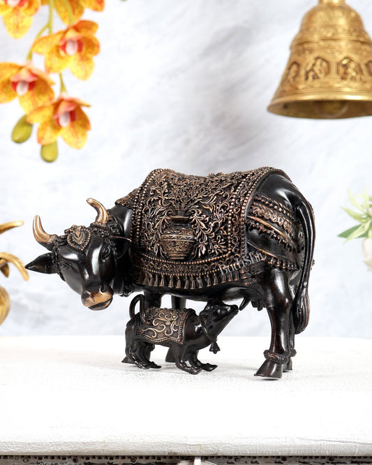 Brass Kamdhenu Cow with Calf Idol | Auspicious Cow & Calf Statue with Kalash Carvings 6.5" black finish - Budhshiv.com