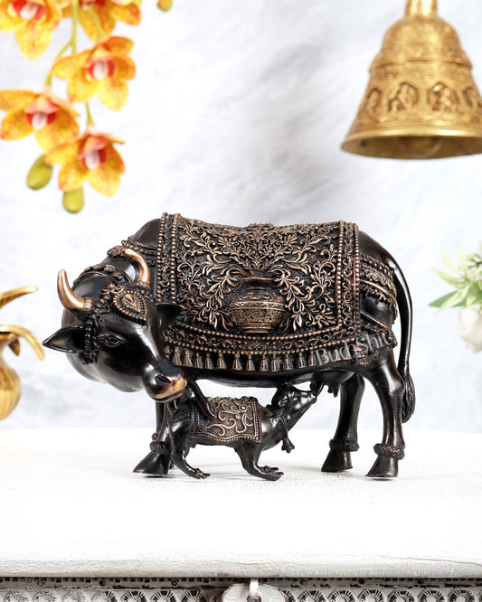 Brass Kamdhenu Cow with Calf Idol | Auspicious Cow & Calf Statue with Kalash Carvings 6.5" black finish - Budhshiv.com