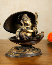 Brass Lord Ganesha Playing Veena Inside Shell – 7” - Budhshiv.com