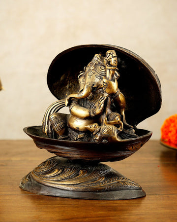 Brass Lord Ganesha Playing Veena Inside Shell – 7” - Budhshiv.com