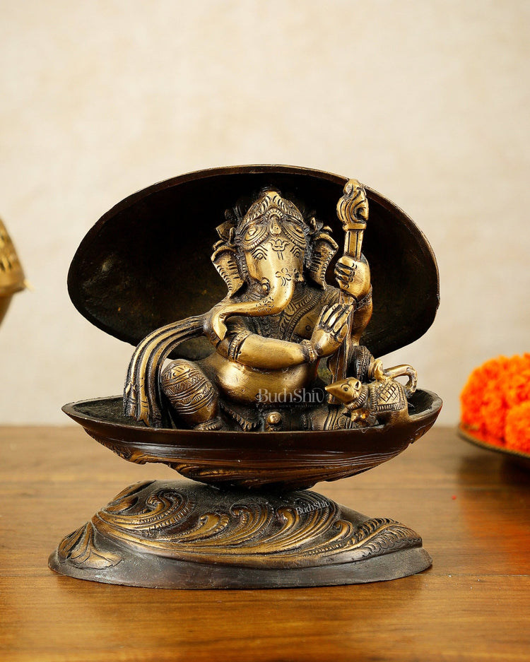 Brass Lord Ganesha Playing Veena Inside Shell – 7” - Budhshiv.com
