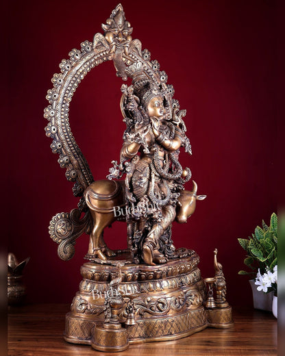 Brass Lord Krishna with Cow on Grand Kirtimukha Pedestal with Twin Peacock Lamps 37.6 inch - Budhshiv.com