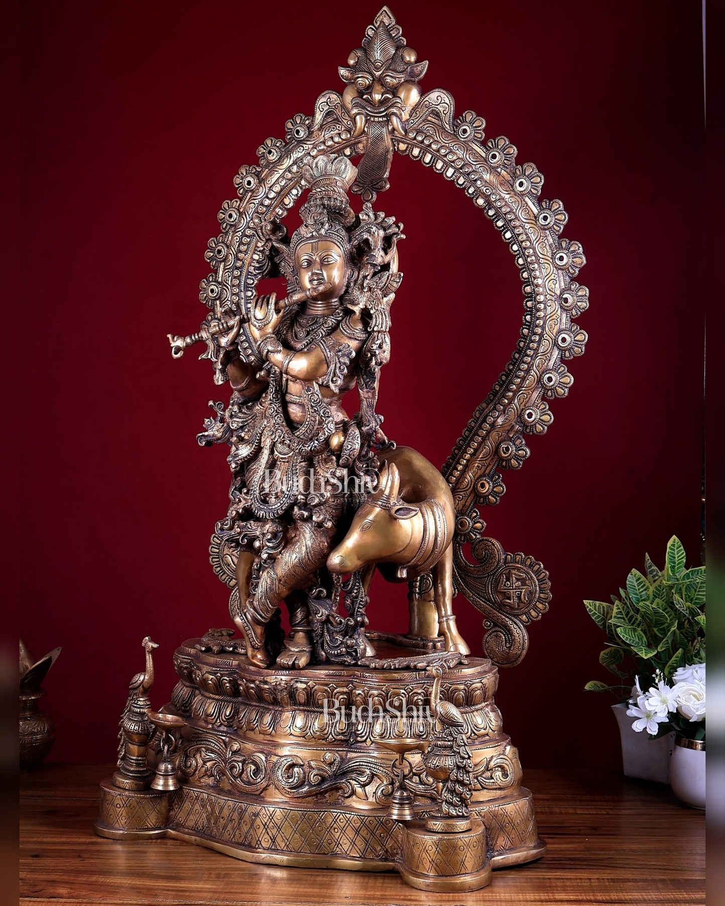 Brass Lord Krishna with Cow on Grand Kirtimukha Pedestal with Twin Peacock Lamps 37.6 inch - Budhshiv.com