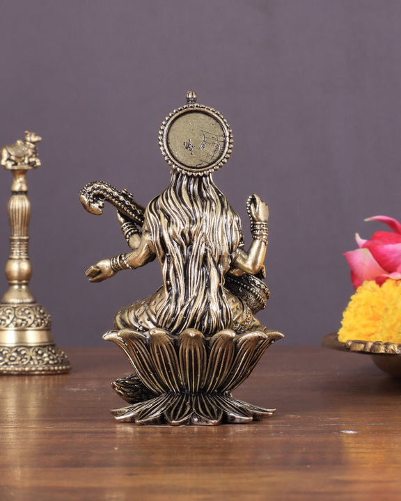 Brass Saraswati Idol Seated on Lotus 4 inch - Budhshiv.com