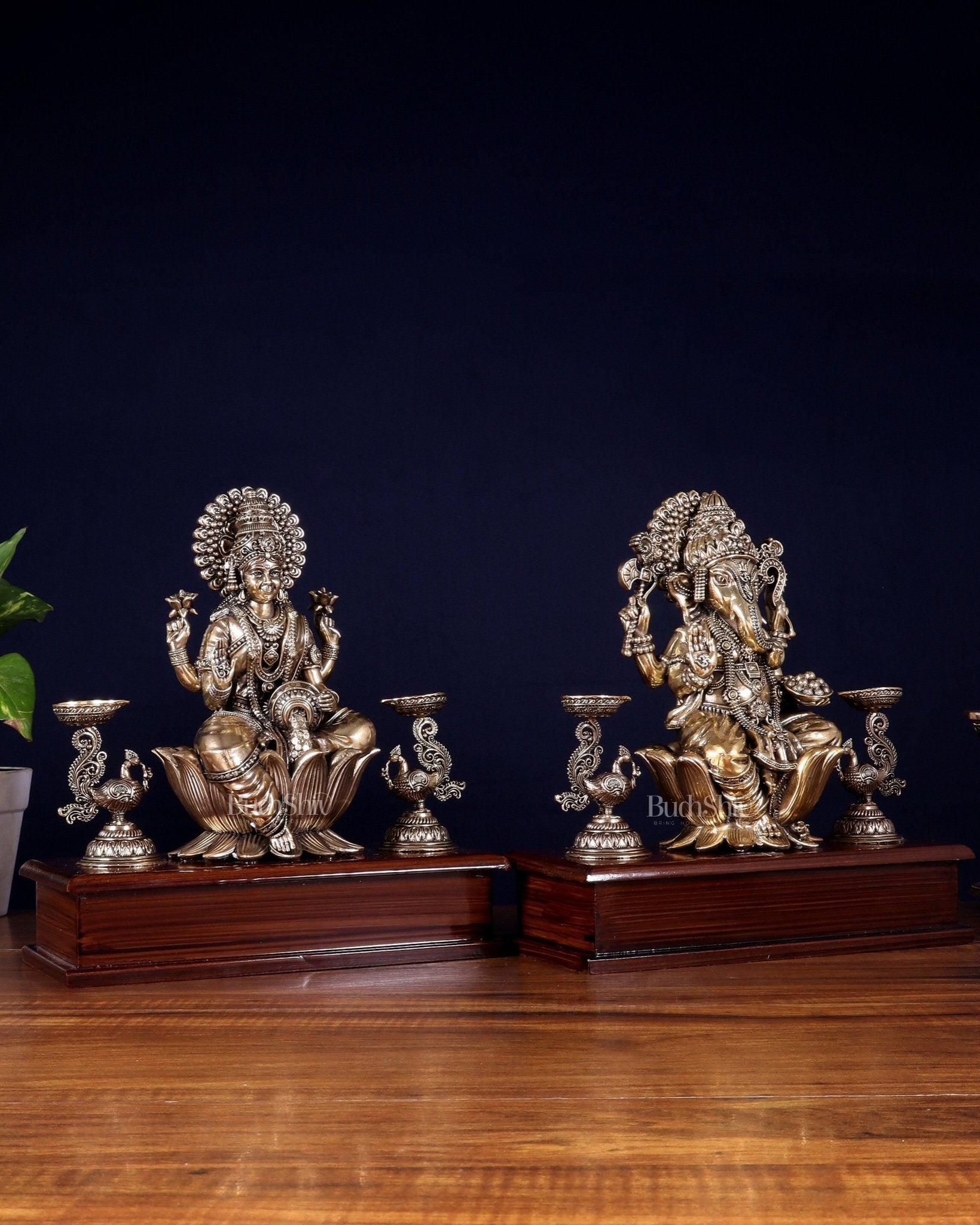 Brass Superfine Ganesh–Lakshmi Pair with Twin Peacock Lamps on Wooden Base – 9.5 Inch - Budhshiv.com