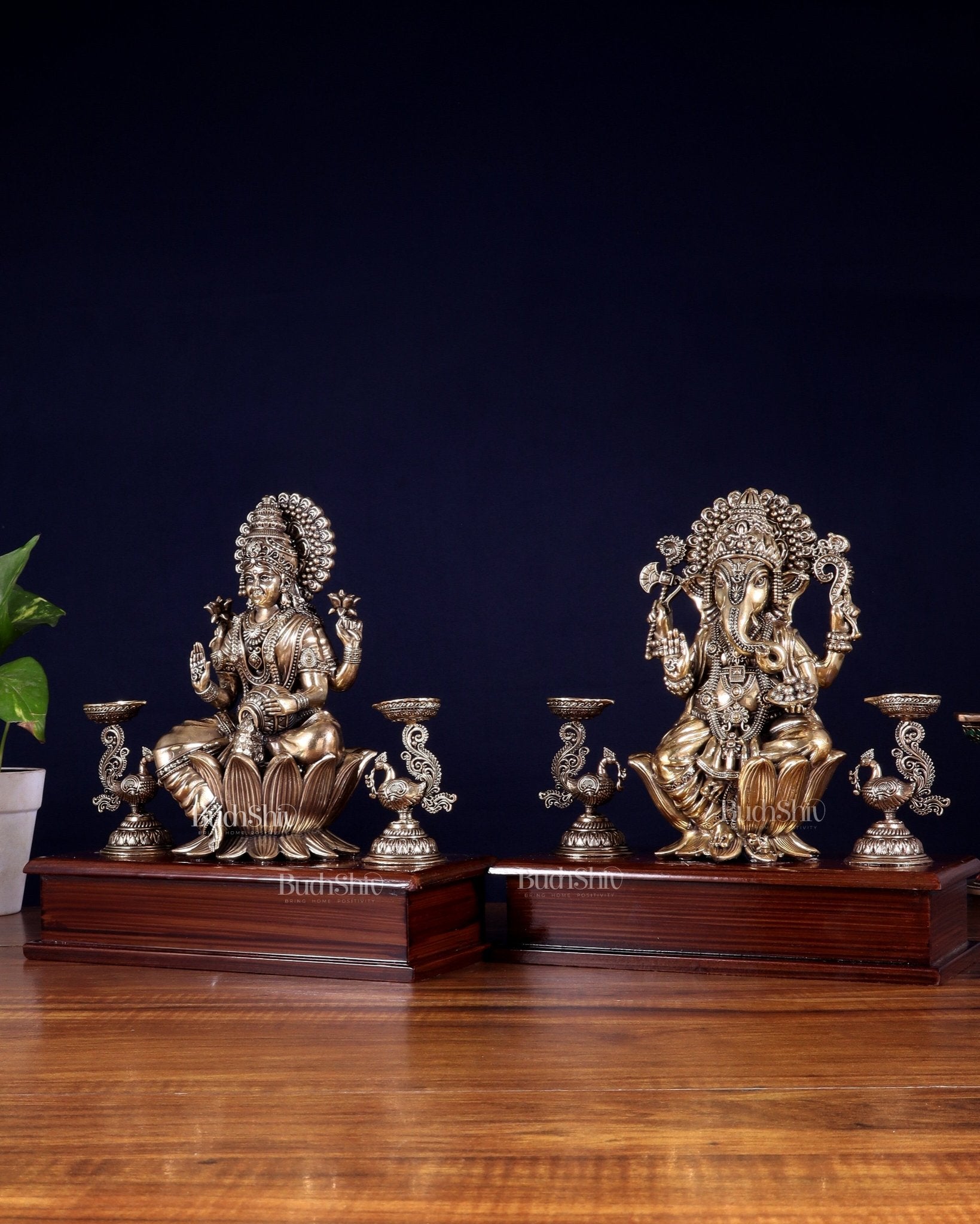 Brass Superfine Ganesh–Lakshmi Pair with Twin Peacock Lamps on Wooden Base – 9.5 Inch - Budhshiv.com
