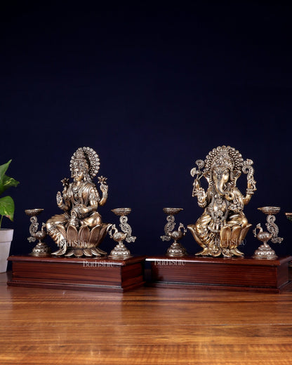 Brass Superfine Ganesh–Lakshmi Pair with Twin Peacock Lamps on Wooden Base – 9.5 Inch - Budhshiv.com