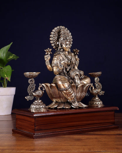 Brass Superfine Goddess Lakshmi Idol with Twin Peacock Lamps on Wooden Base – 9.5 Inch - Budhshiv.com