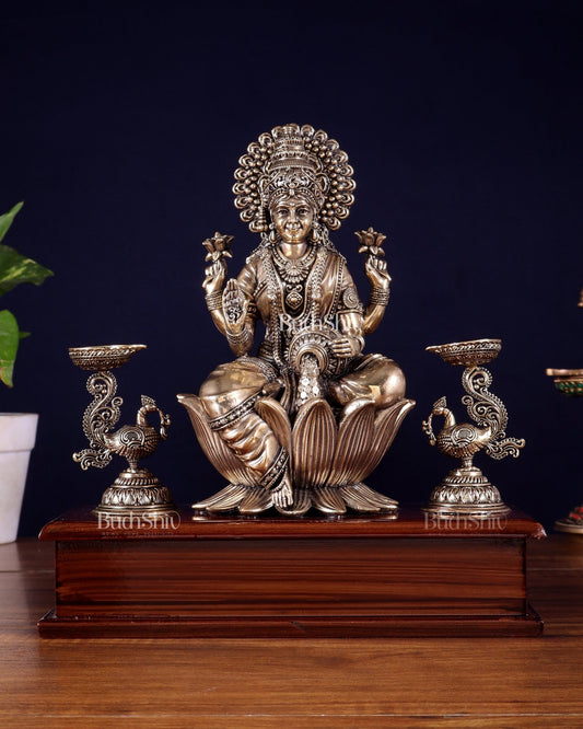 Brass Superfine Goddess Lakshmi Idol with Twin Peacock Lamps on Wooden Base – 9.5 Inch - Budhshiv.com