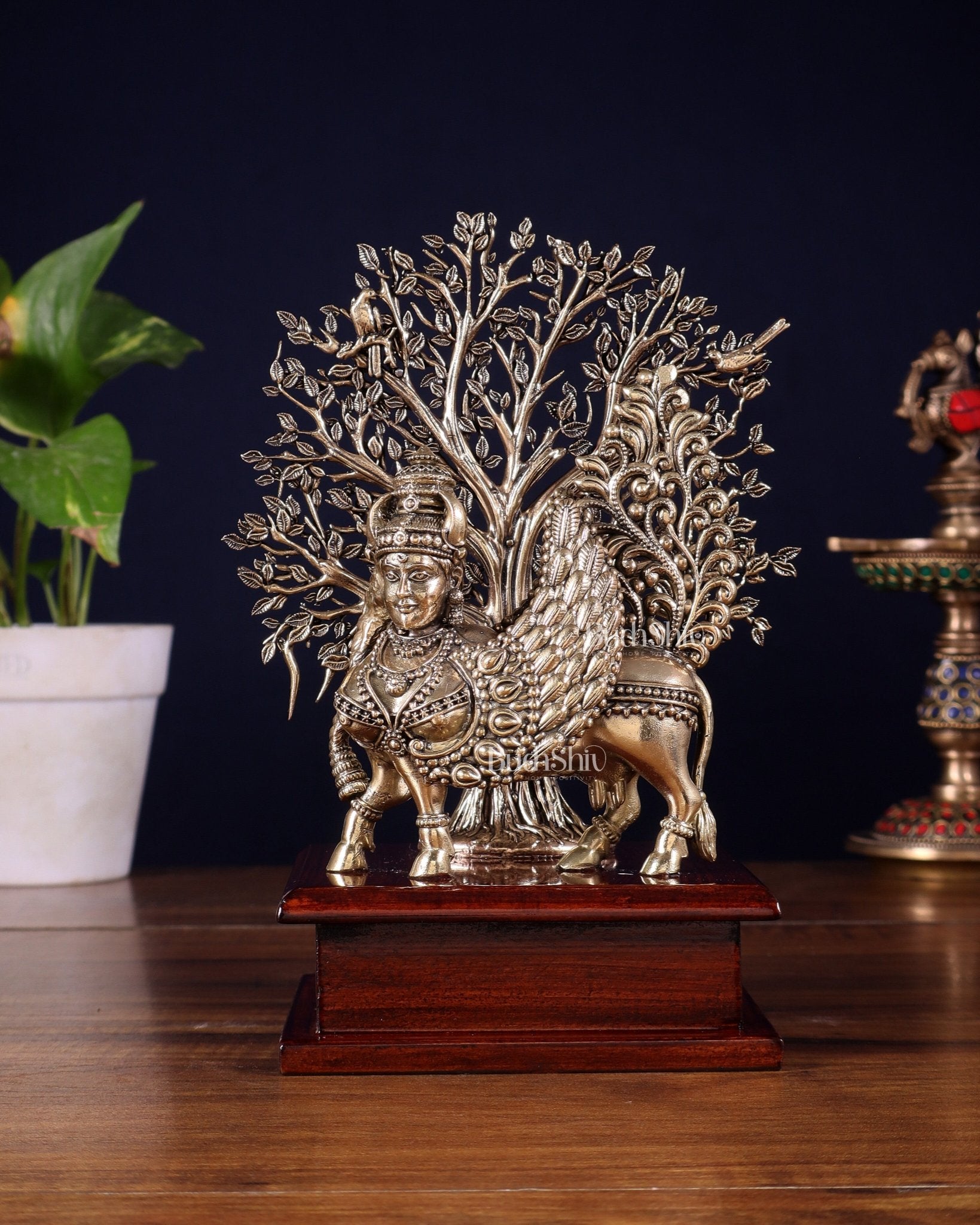 Brass Superfine Kamdhenu Cow with Goddess Face under Kalpavriksha tree on Wooden Base – 8 Inch - Budhshiv.com