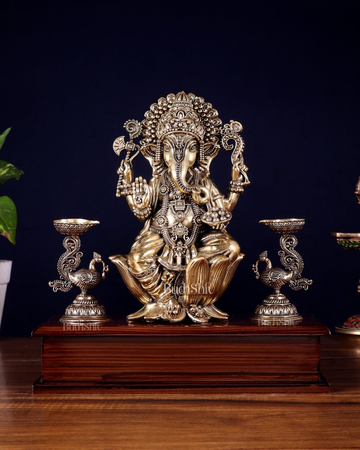 Brass Superfine Lord Ganesha Idol with Twin Peacock Lamps on Wooden Base – 9.5 Inch - Budhshiv.com