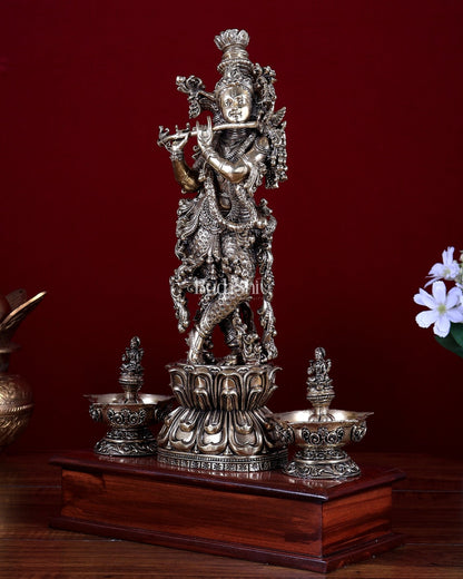 Brass Superfine Lord Krishna Idol with Twin Lakshmi Diyas on Wooden Base - Budhshiv.com