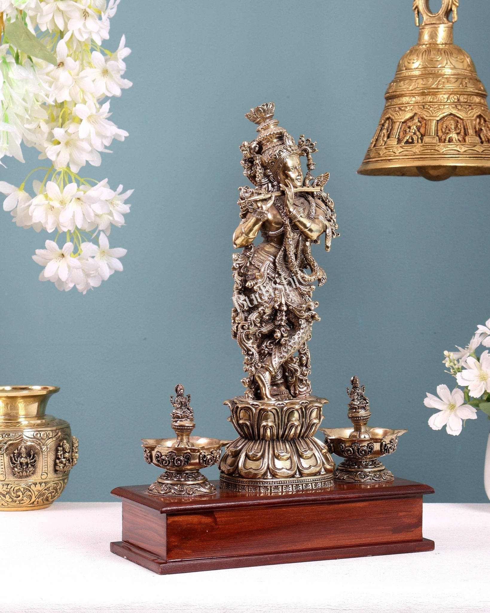 Brass Superfine Lord Krishna Idol with Twin Lakshmi Diyas on Wooden Base - Budhshiv.com