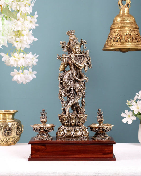 Brass Superfine Lord Krishna Idol with Twin Lakshmi Diyas on Wooden Base - Budhshiv.com