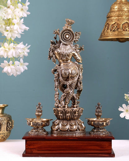Brass Superfine Lord Krishna Idol with Twin Lakshmi Diyas on Wooden Base - Budhshiv.com