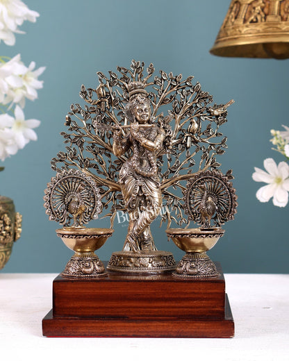 Brass Superfine Lord Krishna with Kalpavriksha & Twin Peacock Lamps on Wooden Base – Decorative Gift Piece (8 Inches) - Budhshiv.com