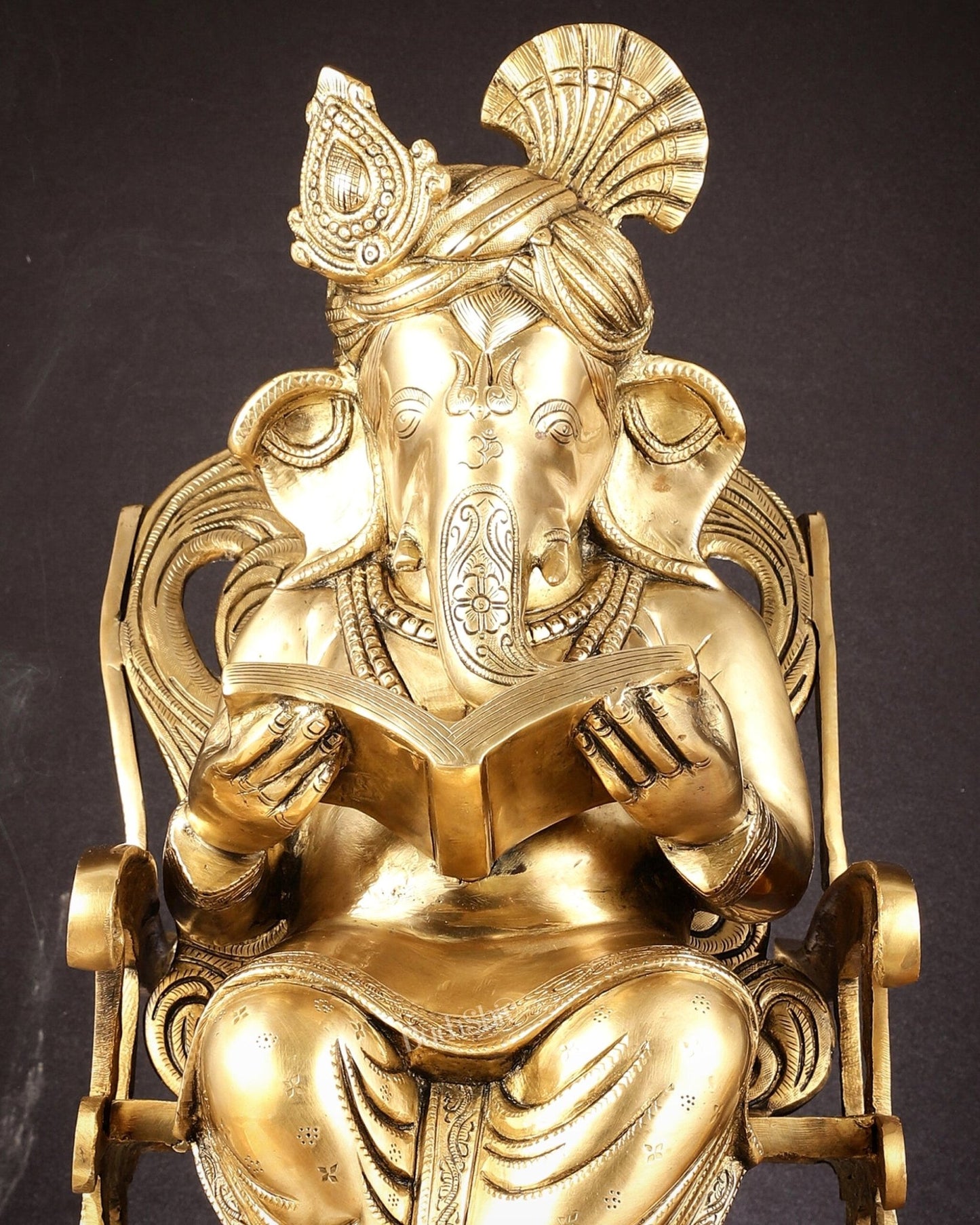 Pure Brass Ganesha Seated on a rocking Chair Reading Book | 24" large - Budhshiv.com