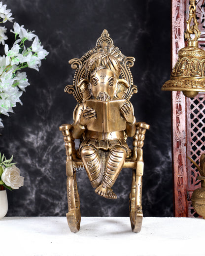 Brass Ganesha on Rocking Chair Reading Book Handcrafted Statue (17.5 Inch)