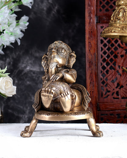 Unique Brass Resting Ganesha with Long Braided Hair – Handcrafted Masterpiece