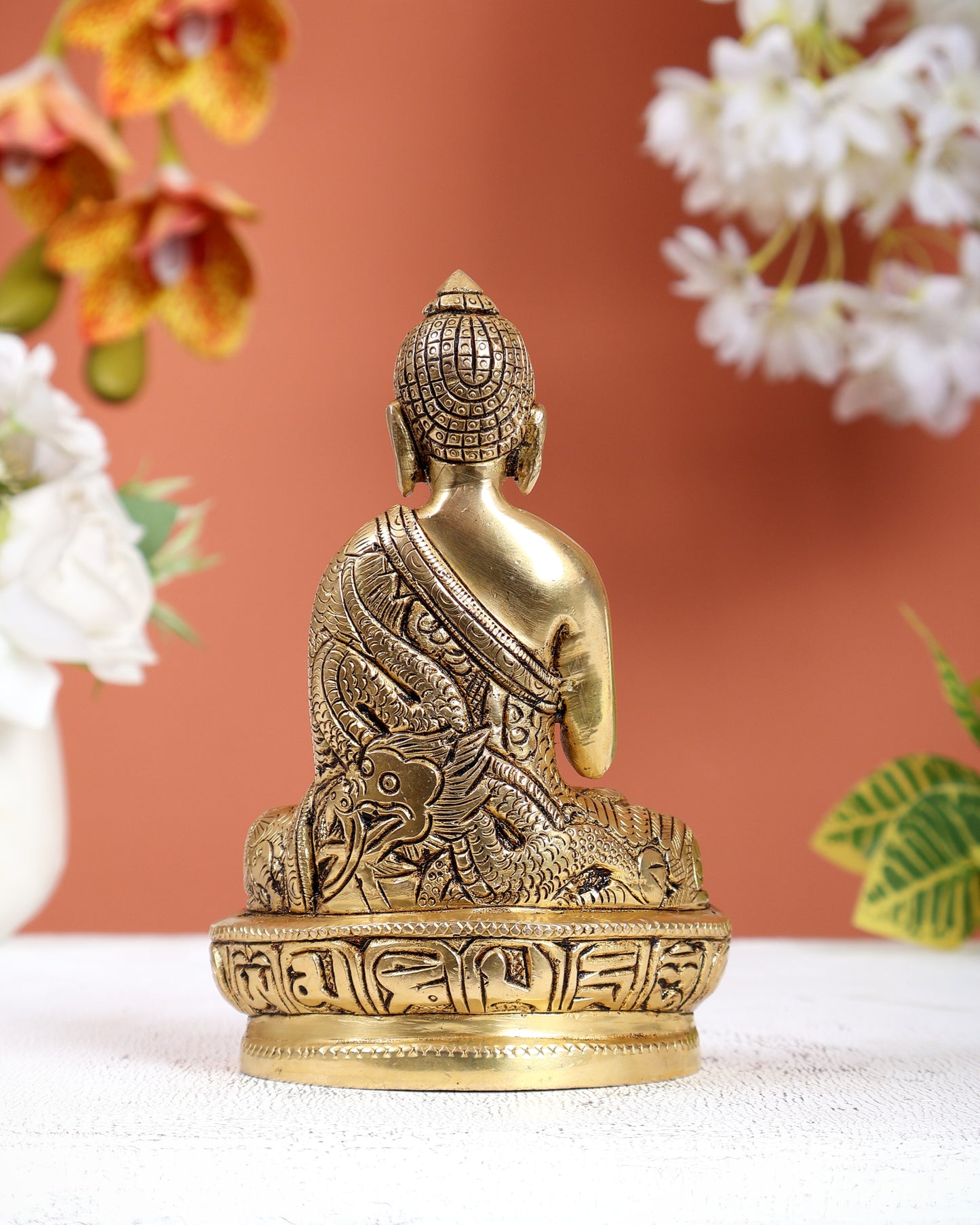 Brass Buddha Statue with Dragon Carvings – Intricately Detailed Small Sculpture