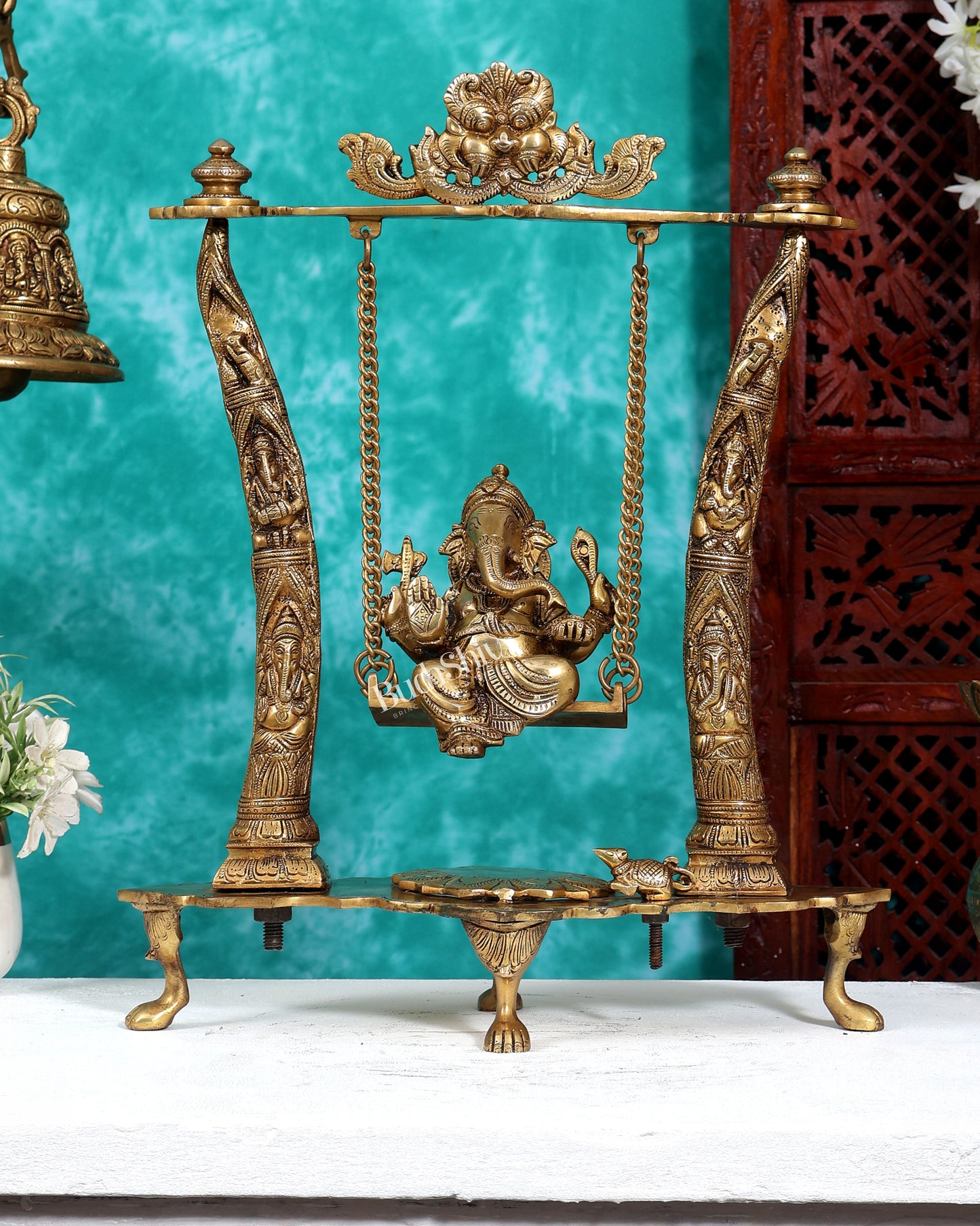 Brass Ganesha Idol on Swing with Pillars Decorated with Ganesha Figures 17 inch