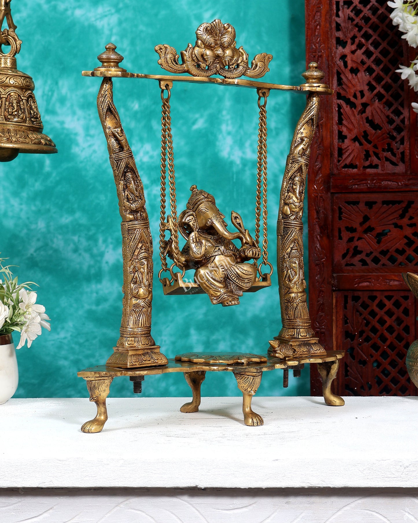 Brass Ganesha Idol on Swing with Pillars Decorated with Ganesha Figures 17 inch