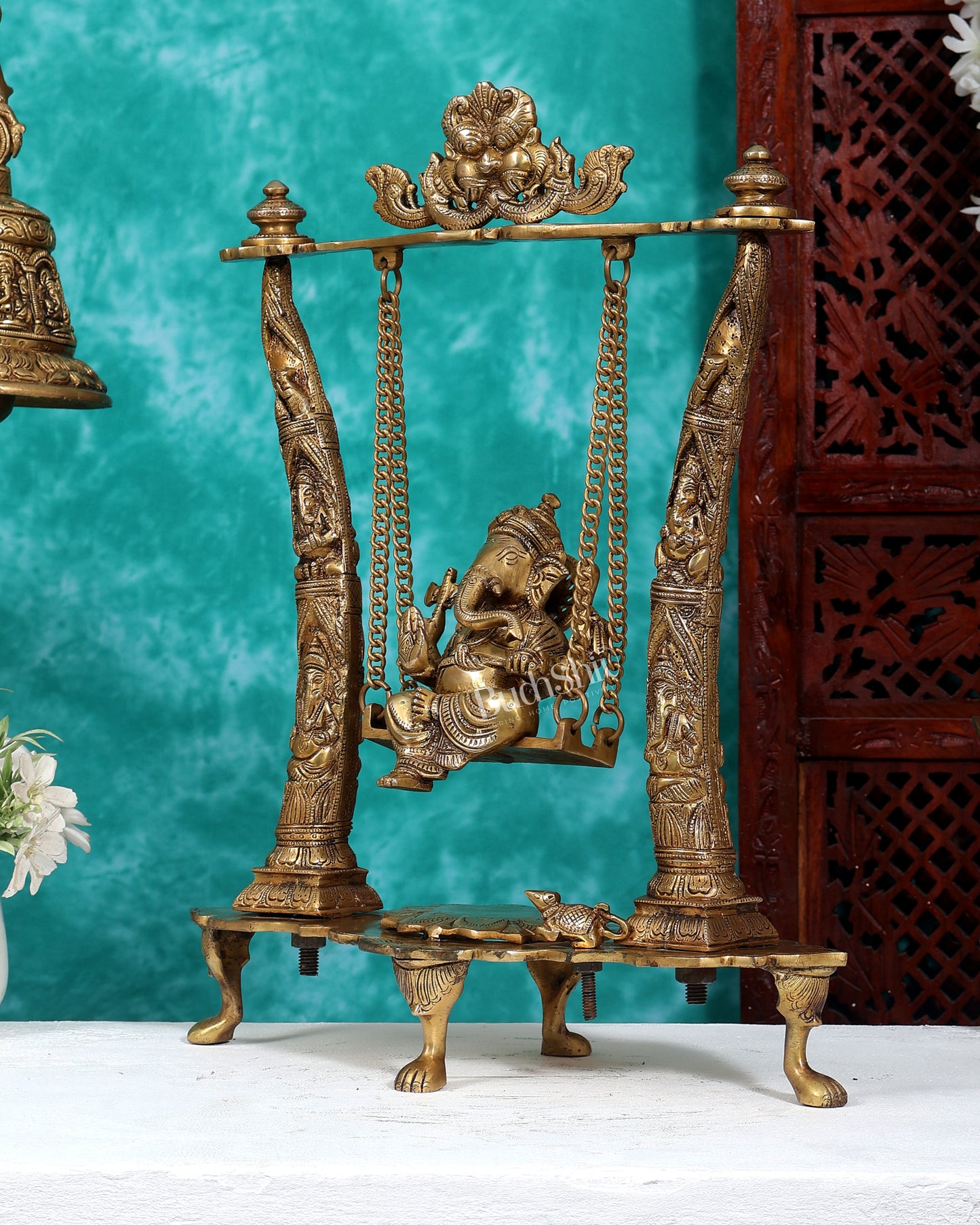 Brass Ganesha Idol on Swing with Pillars Decorated with Ganesha Figures 17 inch